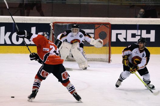 ZELL AM SEE; AUSTRIA - SEPTEMBER 4: Red Bull Salute Tournament Semifinal. Andre Rankel shoots at Bern goalie Marco Buehrer. Game between SC Bern and Eisbaeren Berlin (Result 1-5) on September 4, 2010.