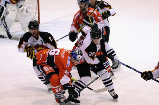 ZELL AM SEE; AUSTRIA - SEPTEMBER 4: Red Bull Salute Tournament Semifinal. Hard hit to the head from Pluess (Bern) vs. Busch (Berlin).  Game between SC Bern and Eisbaeren Berlin (Result 1-5) on September 4, 2010.