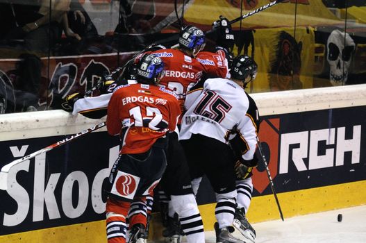 ZELL AM SEE; AUSTRIA - SEPTEMBER 4: Red Bull Salute Tournament Semifinal. Scrum at the boards.  Game between SC Bern and Eisbaeren Berlin (Result 1-5) on September 4, 2010.