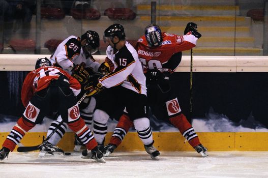 ZELL AM SEE; AUSTRIA - SEPTEMBER 4: Red Bull Salute Tournament Semifinal. Hard action at the boards.  Game between SC Bern and Eisbaeren Berlin (Result 1-5) on September 4, 2010.