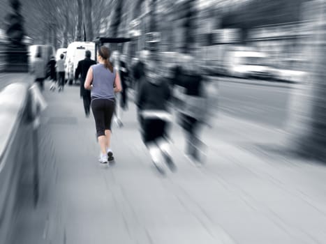 Girl running on the street, with motion blur
