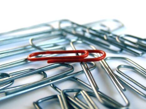 Leader Red clip among silver clips
