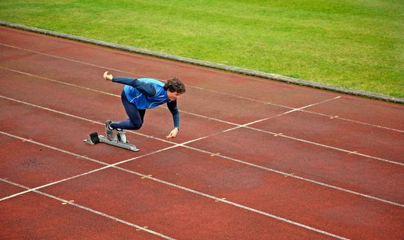 An athlete runs off the starting block
