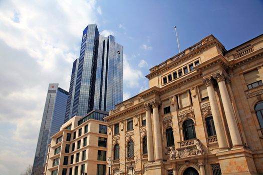 The modern twin tower of Deutsche Bank right next to an old Baroque building, Frankfurt, Germany