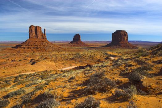 Red rock - semi-desert and the red rock of the Monument Valley with on the background of the famous table mountains