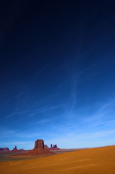 Red rock - semi-desert and the red rock of the Monument Valley with on the background of the famous table mountains