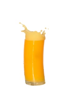 Nice yellow glass of splashing orange juice isolated on white background with clipping path