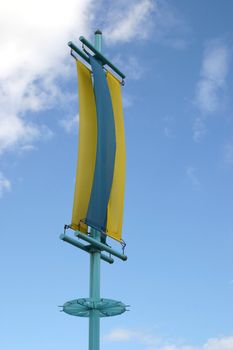 yellow and blue banner against the sky