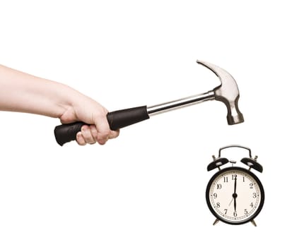 Alarm Clock and hammer in hand isolated on white background