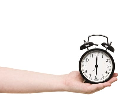 Hand holding Alarm Clock isolated on white background