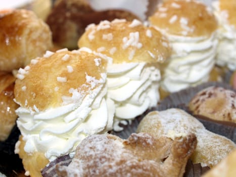 Mixed pastries with chocolate, cream, fruit