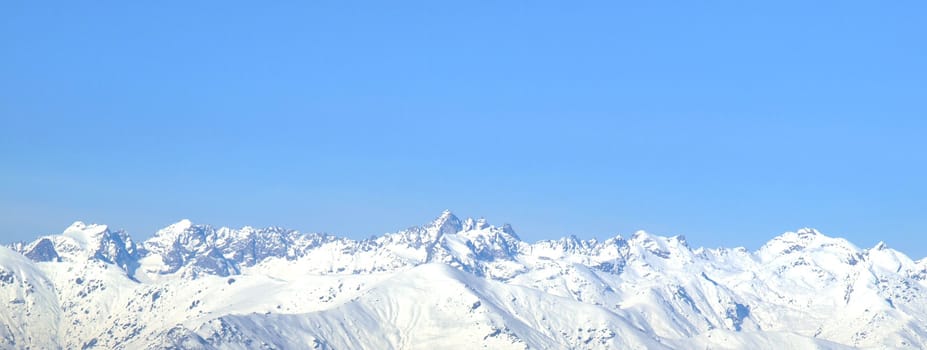 Italian Alps mountains panorama with snow and blue sky