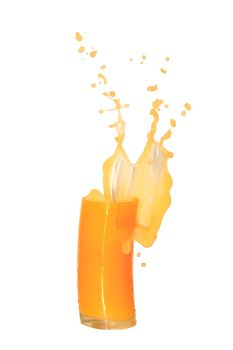 Nice yellow glass of splashing orange juice isolated on white background with clipping path