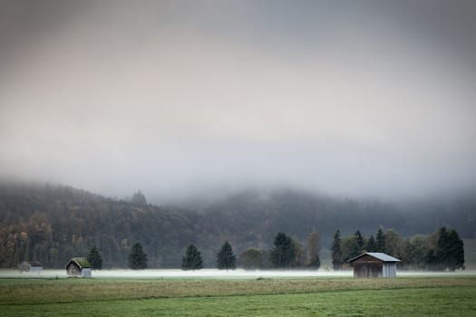 An image of a beautiful landscape with fog in bavaria germany