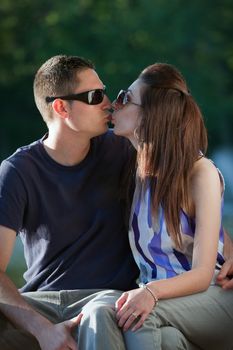 A young happy couple making out kissing.