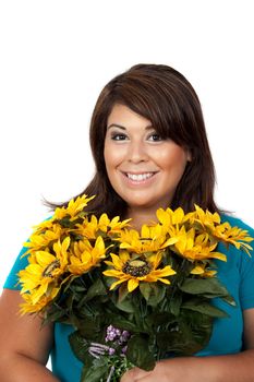 This young smiling hispanic woman looks totally and completely pleased with this bouquet of sunflowers.