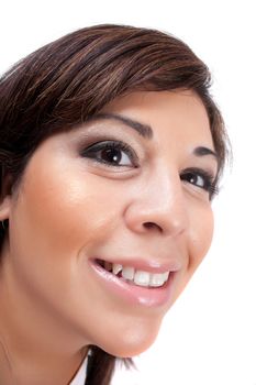 Woman with a happy look on her face smiles over a white background. Shallow depth of field.