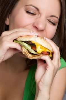Beautiful woman eating hamburger food