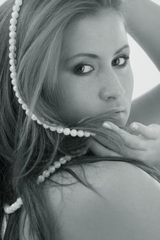 monochrome portrait of lovely lady with white pearl beads