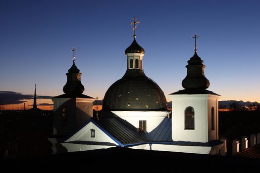 Orthodox temple with illumination on a background of a decline