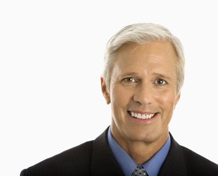 Middle aged Caucasian man in business suit smiling at viewer.