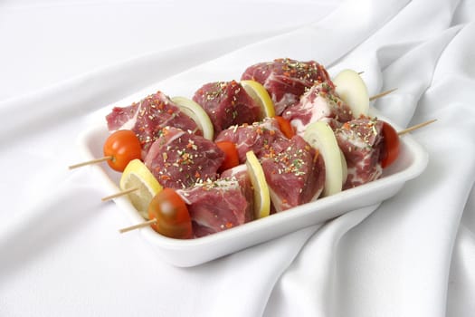 Preparation of a fresh shish kebab with vegetables