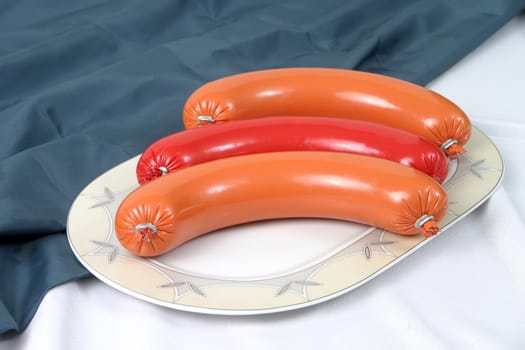 Ready boiled sausage on a plate