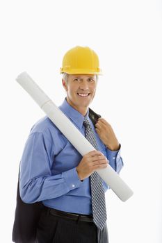 Caucasian middle aged businessman holding blueprints and wearing hard hat.