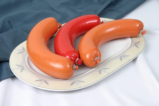 Ready boiled sausage on a plate