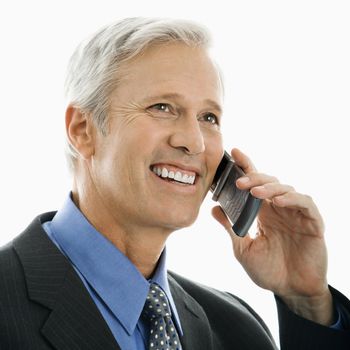 Caucasian middle aged man smiling and talking on cell phone.