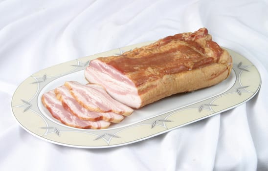 delicious applewood-smoked bacon atop a cutting