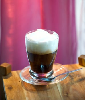 Cappuccino with pink background