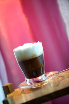Cappuccino with pink background