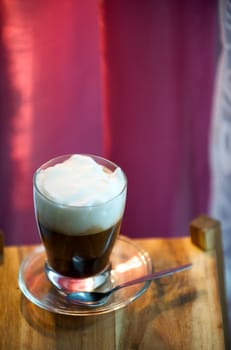 Cappuccino with pink background