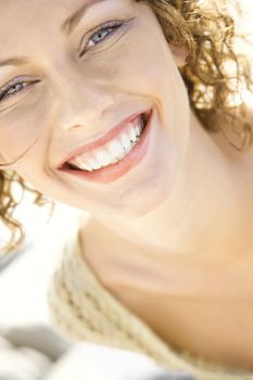 Close-up portrait of smiling Caucasian young adult female.