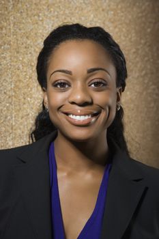 Attractive African American businesswoman smiling at viewer.