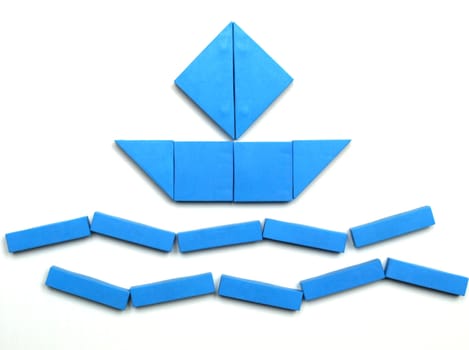Tangram game toy with ship at sea