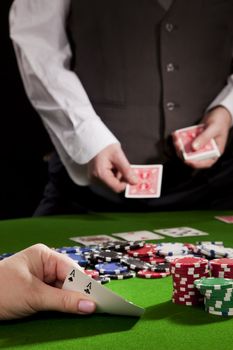 Playing poker in the casino with winning hand