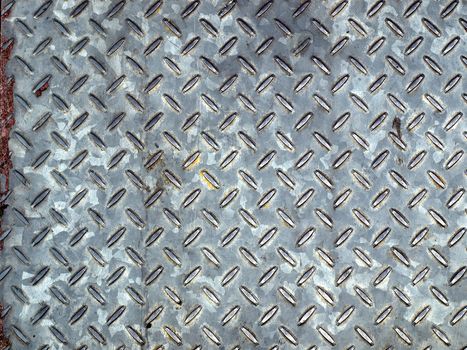 Diamond steel plate useful as a background