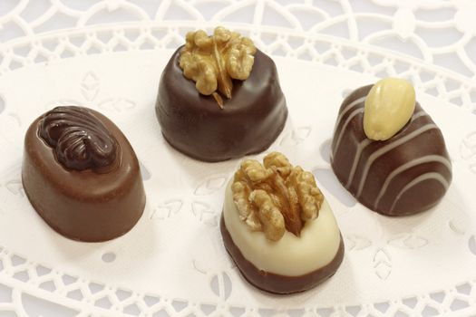 Four tasty chocolates with nuts