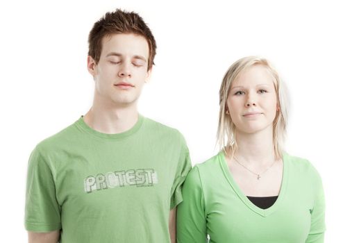 isolated cute young couple in love over white background wearing green shirts