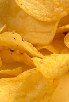Food background: closeup of a heap of  potato crisps