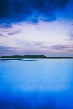 Finnish lake landscape shot at dawn with heavy postprocessing