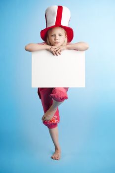 Young girl on one foot standing and holding a empty note