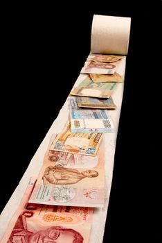Banknotes on toilet paper, financial crisis concept