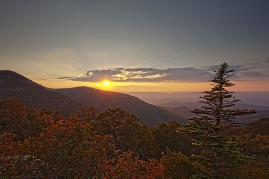 View over the blue ridge mountains at sunset in the autumn processed in HDR