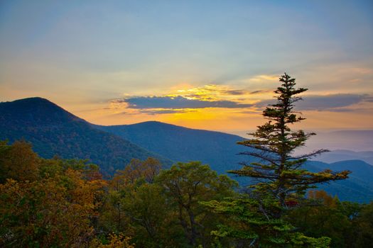 View over the blue ridge mountains at sunset in the autumn processed in HDR