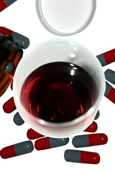 glass of wine with drugs showing they dont mix