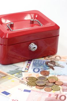 Red lockbox with Euro bills and coins