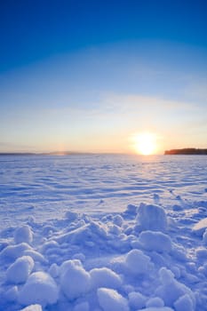 Sunrise at cold morning on the lake in Finland